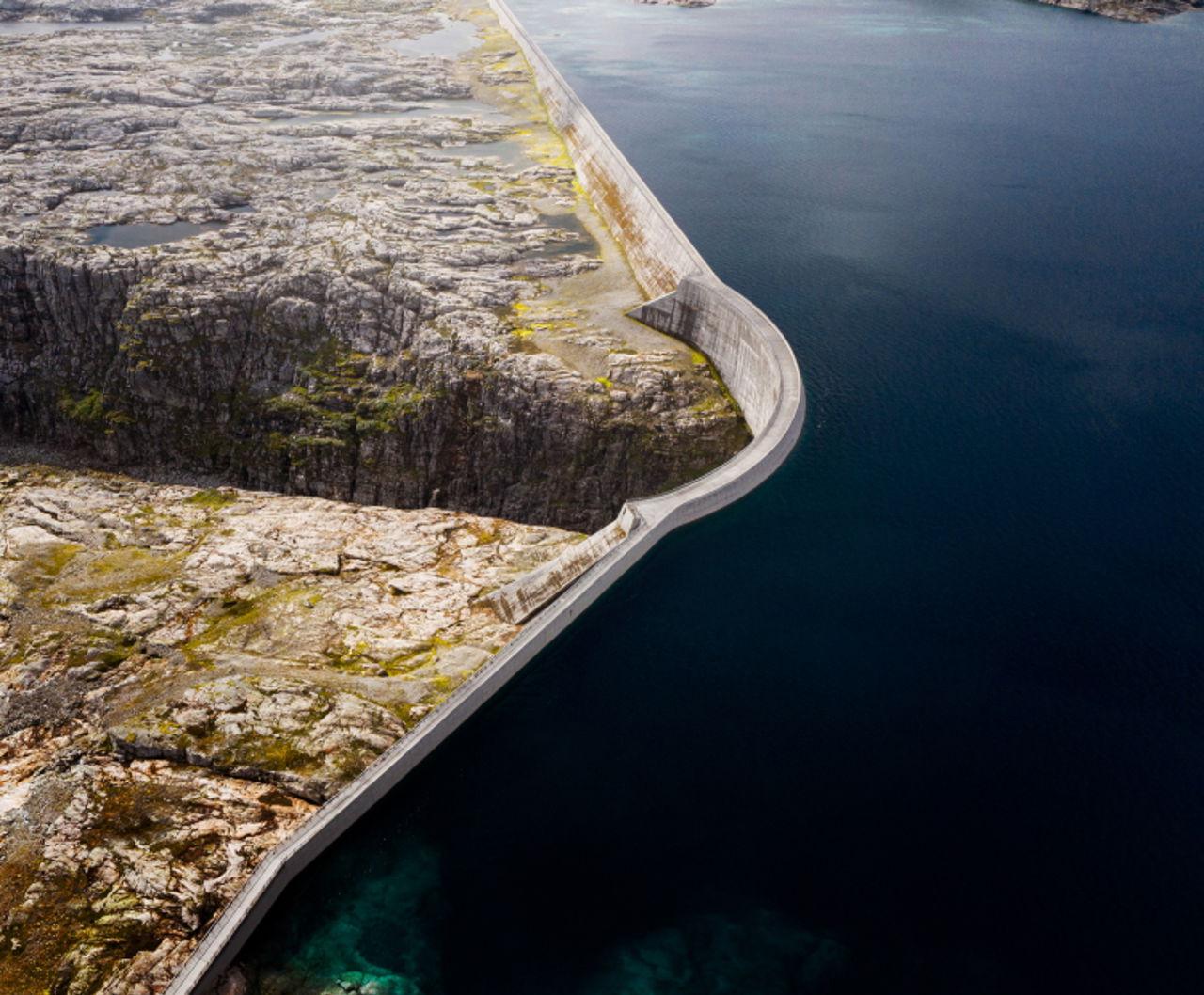 Dam of blue water showing power plant and renewable energy certificate